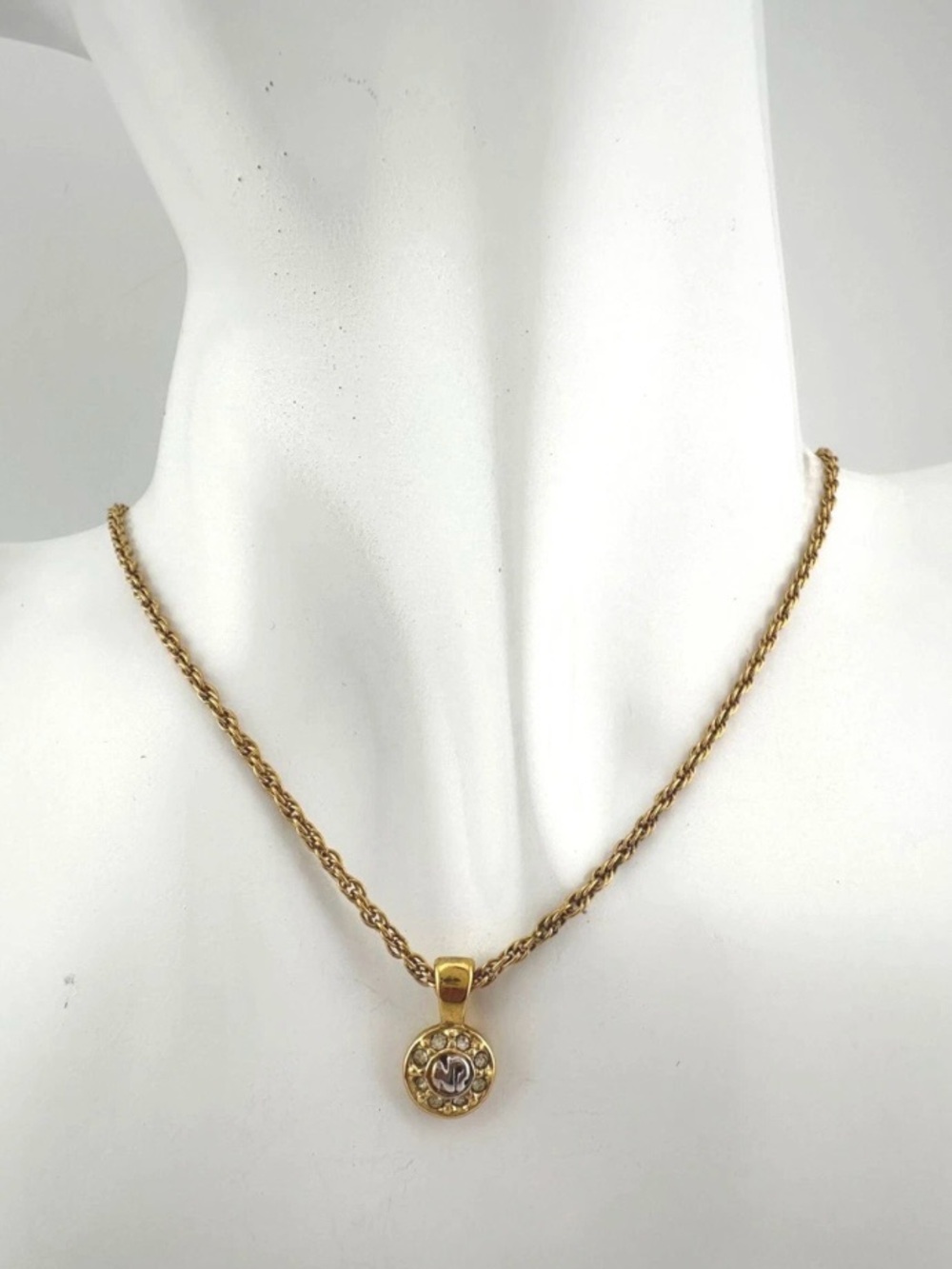 Nina Ricci Gold-Tone Circular Pendant Necklace with Silver 'NR' Accent